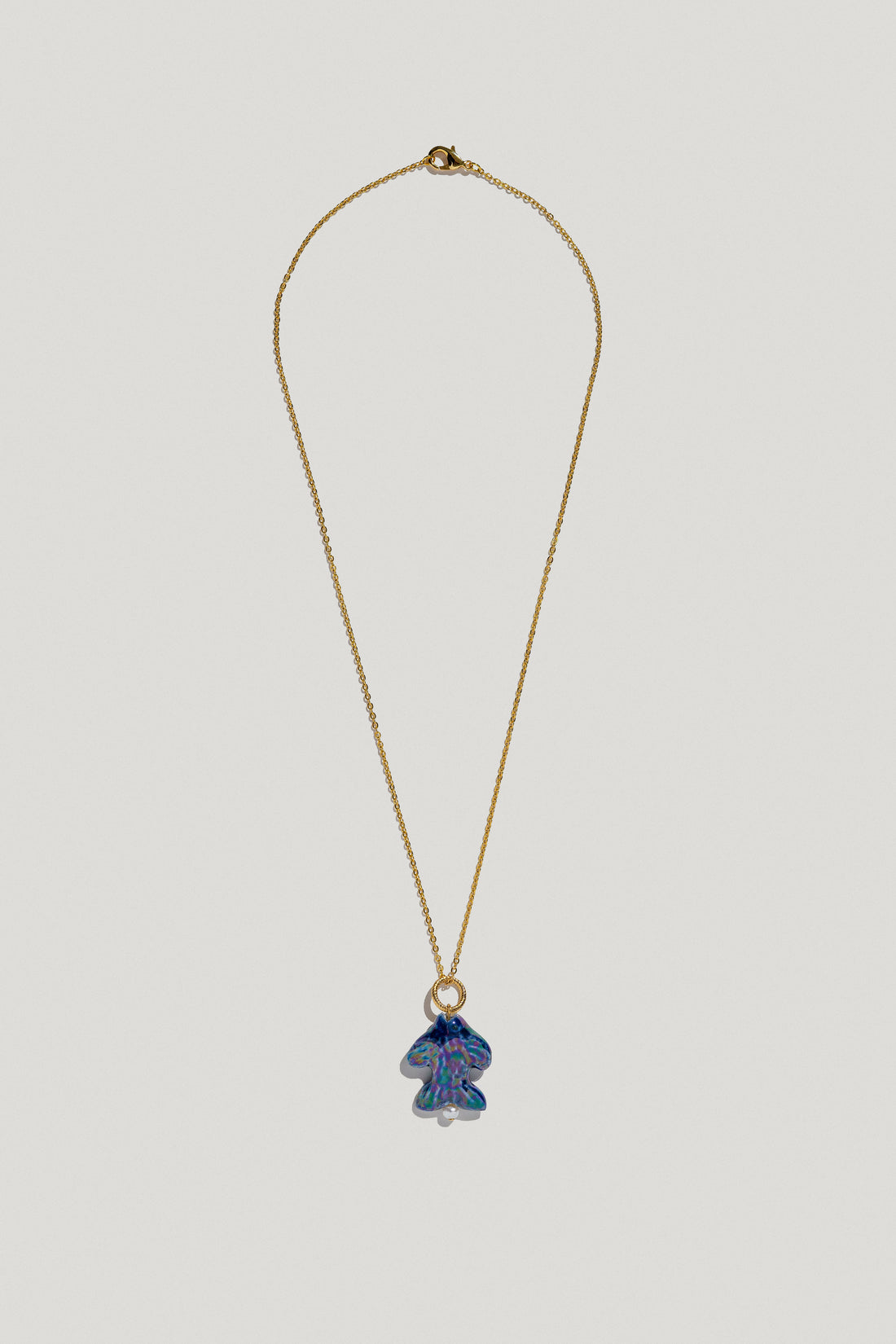 Khvyli dark blue fish pendant on a chain