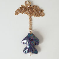 Khvyli dark blue fish pendant on a chain