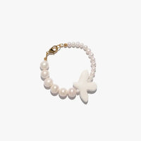 Myrni bracelet with two types of pearls and a porcelain bird