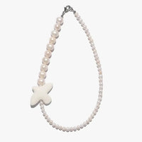 Myrni necklace with double-sized pearls and a porcelain bird