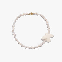 Myrni necklace with ear-shaped pearls and a porcelain bird