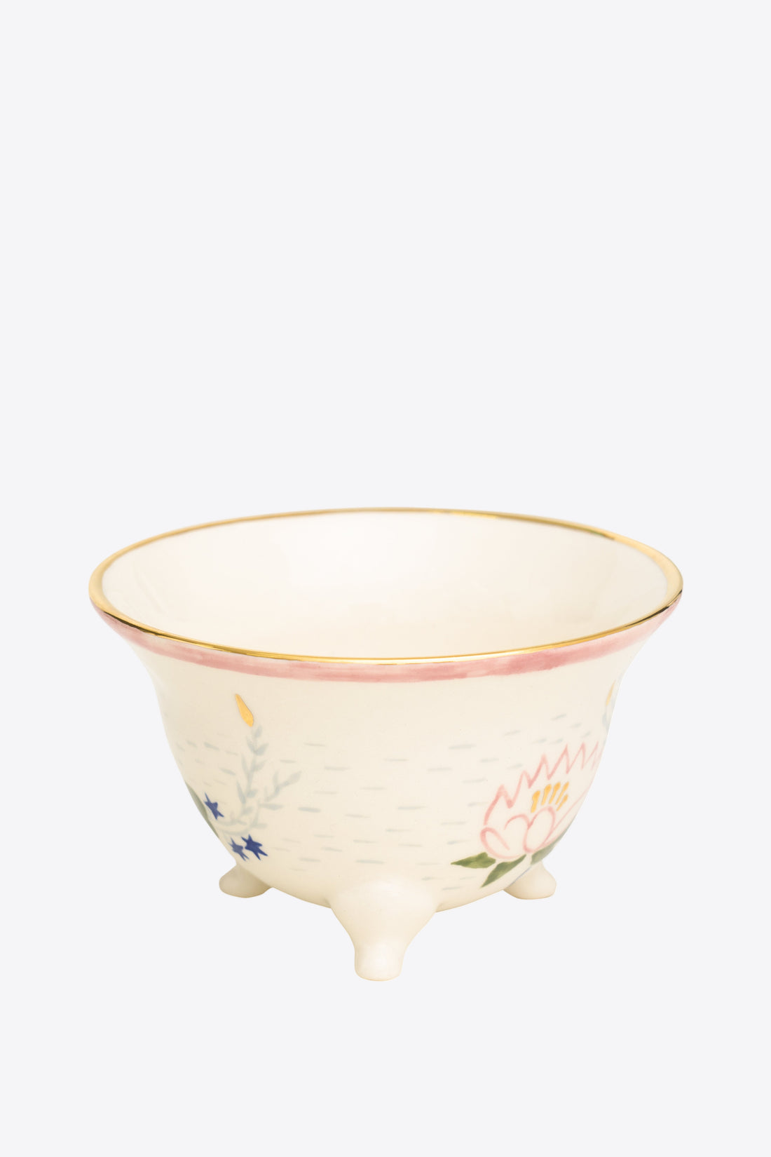 Ceramic cup with floral design on a white background