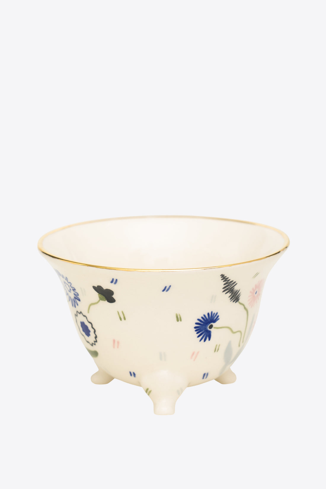 Ceramic cup with floral design on a white background