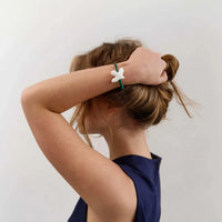 Myrni bracelet with malachite and a porcelain bird