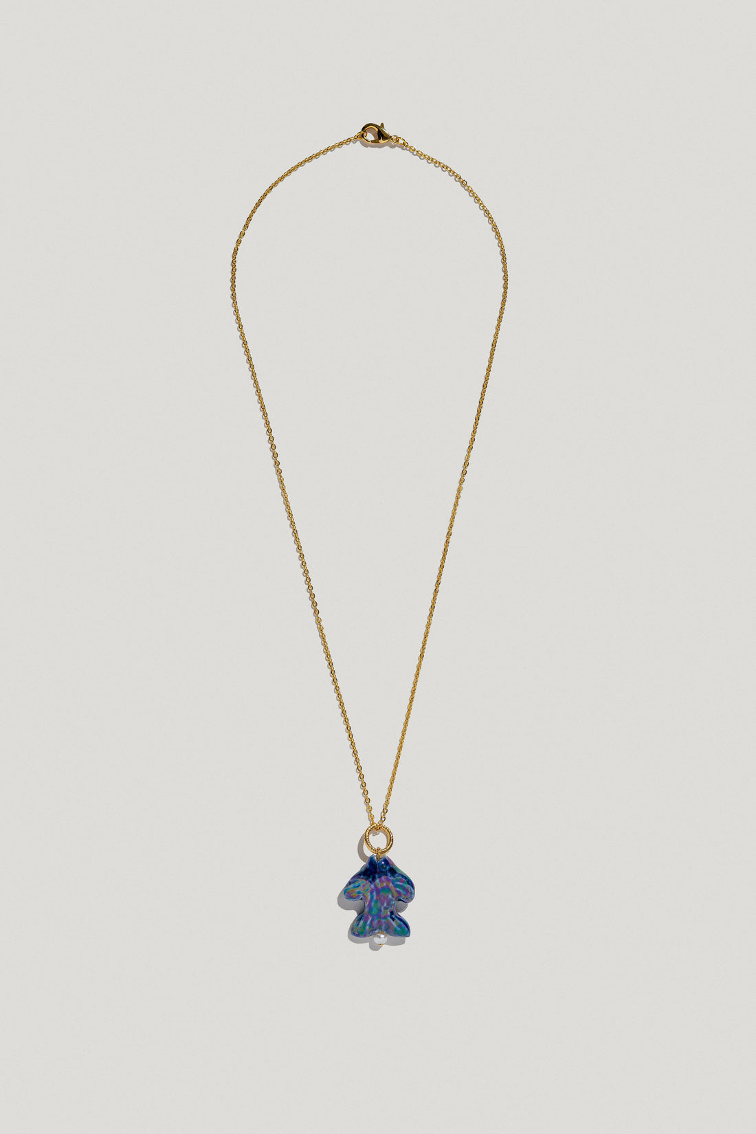 Khvyli dark blue fish pendant on a chain
