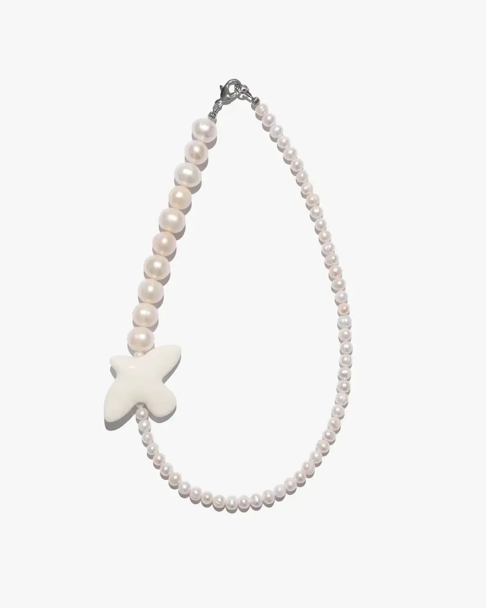 Myrni necklace with double-sized pearls and a porcelain bird