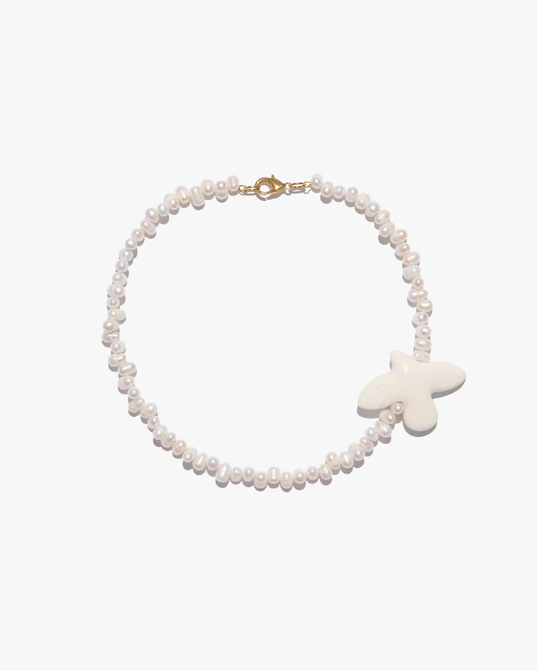 Myrni necklace with ear-shaped pearls and a porcelain bird