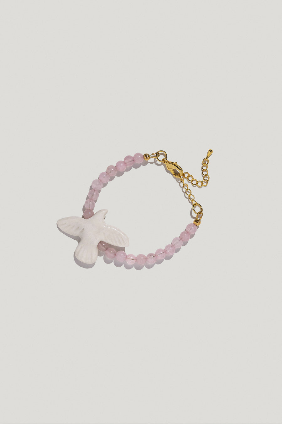 Myrni bracelet with bubble-gum quartz and a porcelain bird