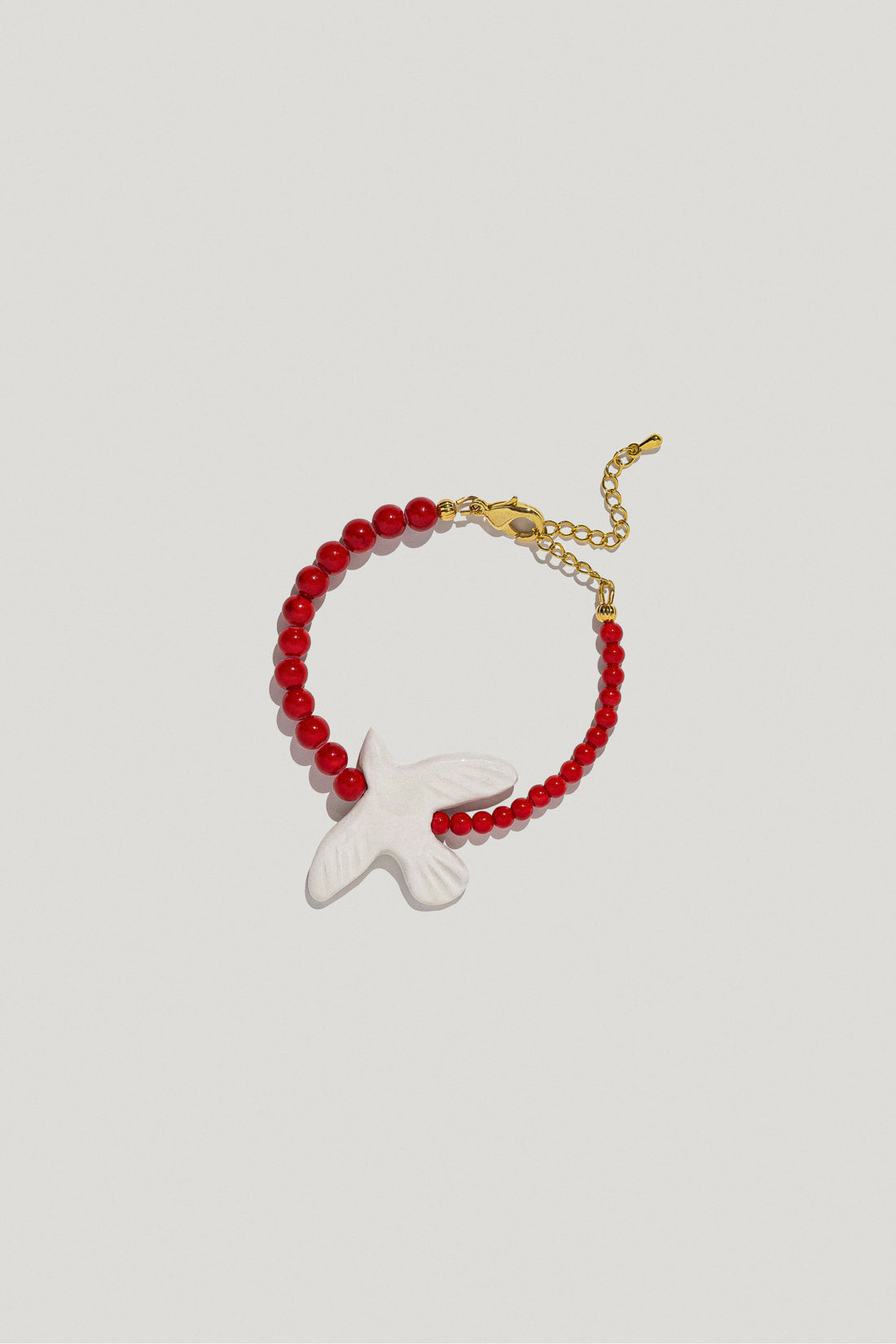 Myrni bracelet with corals and a porcelain bird