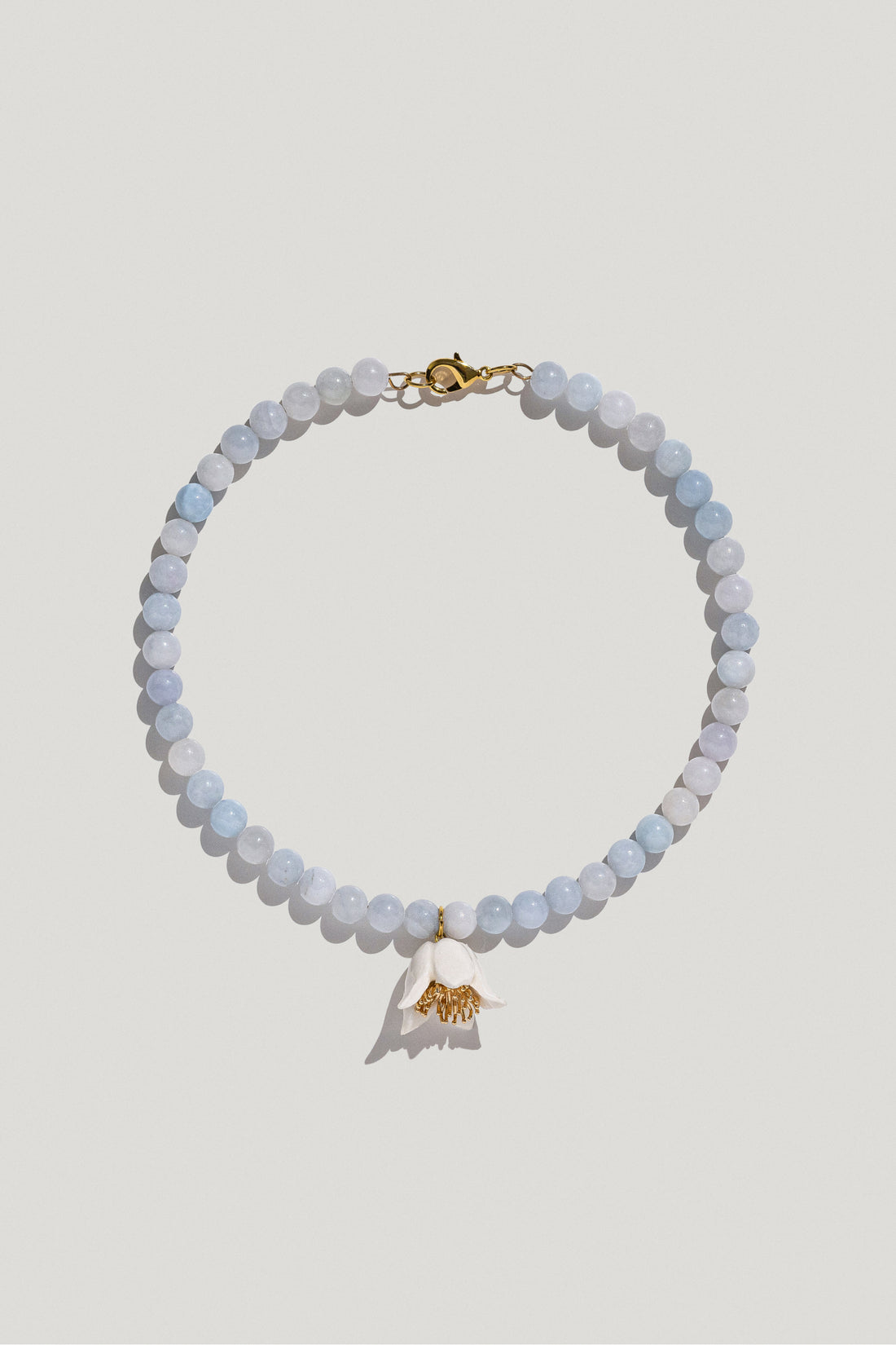 Polysk necklace with blue quartz and white flower