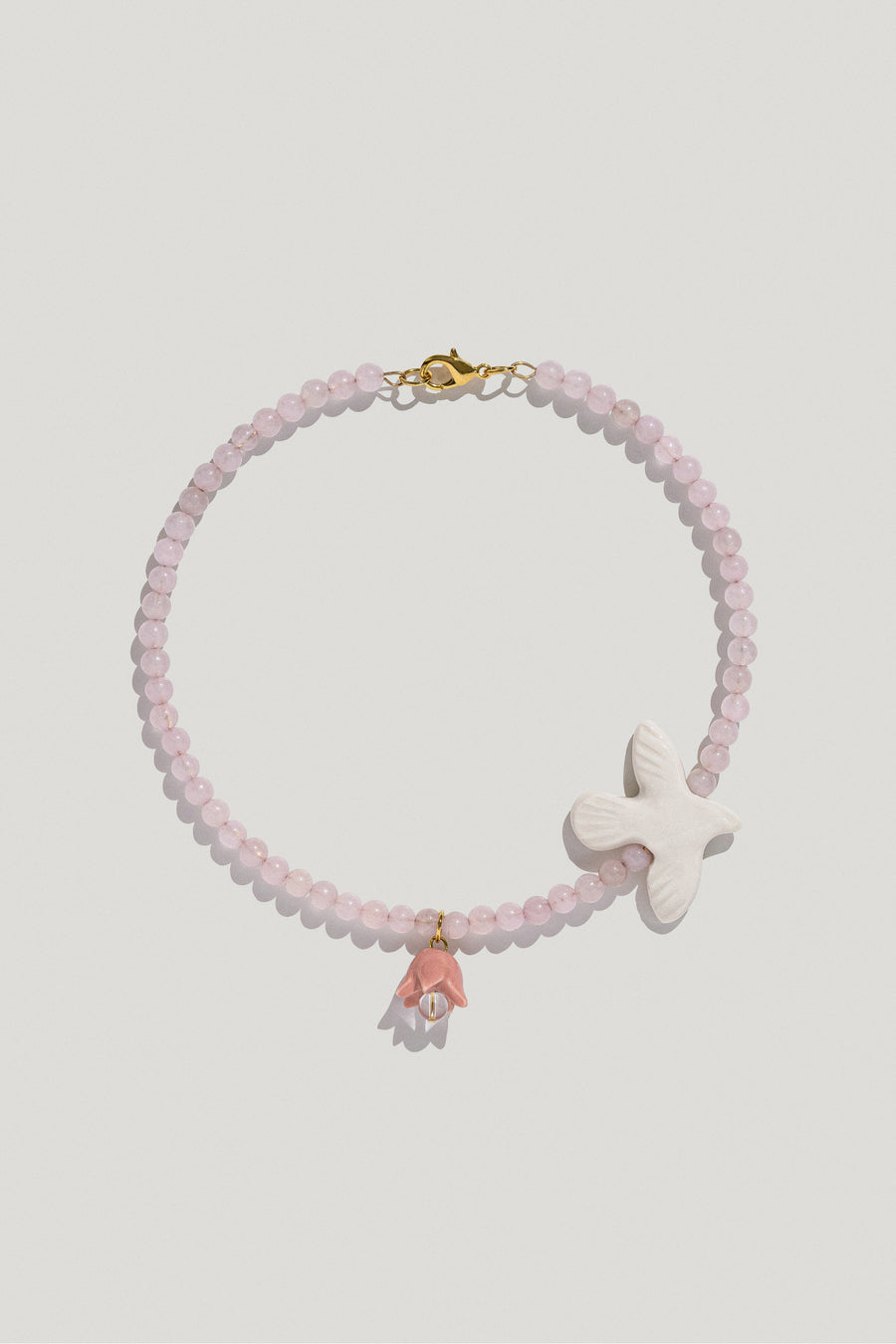 Polysk necklace with bubble-gum quartz, porcelain bird and flower