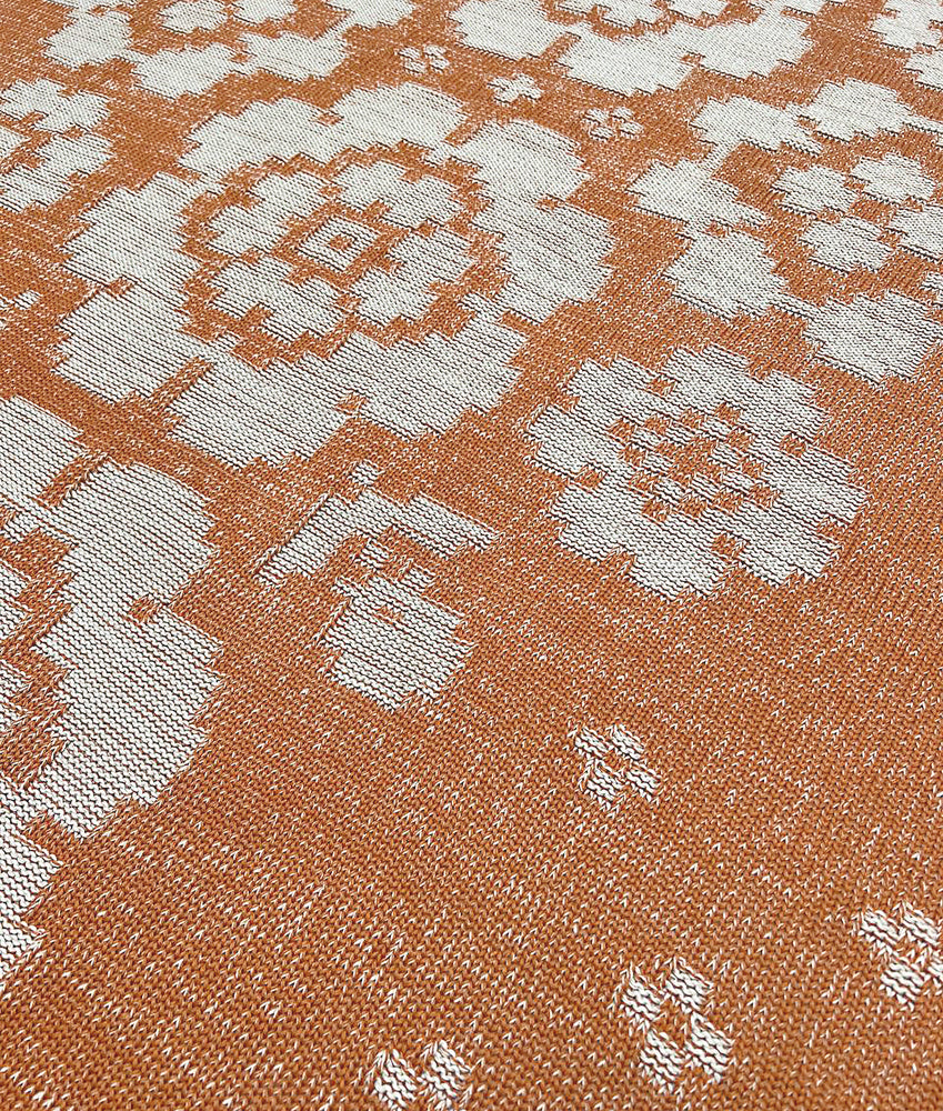 Blanket with hollyhocks in rust