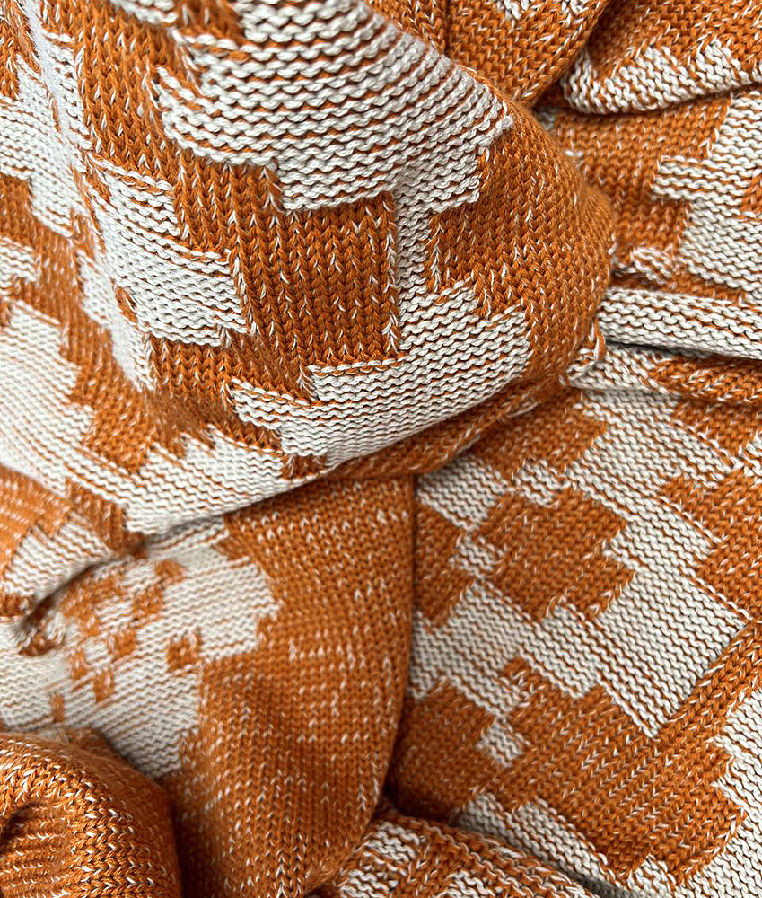 Blanket with hollyhocks in rust